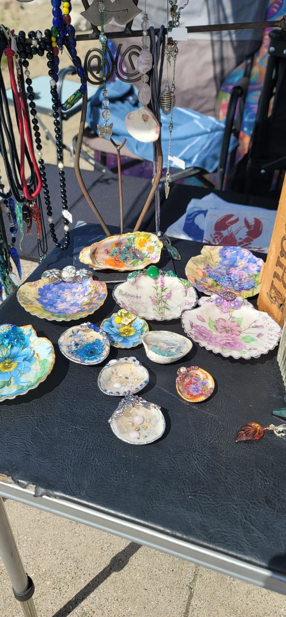 Second tide table: hydrangea, lavender, wildflower, and pearl shells with hanging jewelry